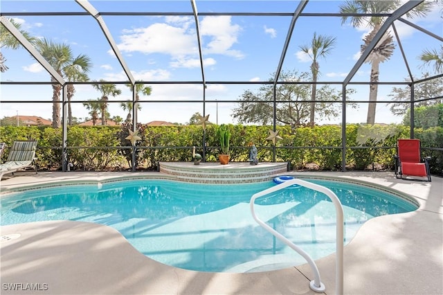 view of swimming pool with a patio area and glass enclosure