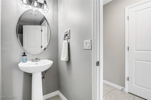 bathroom featuring tile patterned flooring and sink