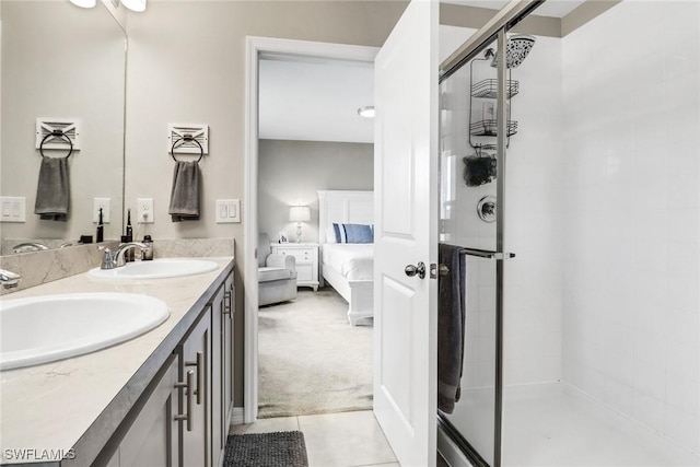 bathroom with vanity, tile patterned floors, and an enclosed shower