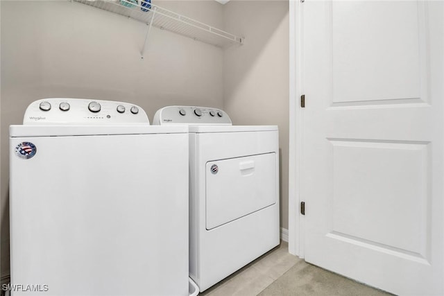 washroom featuring washer and clothes dryer