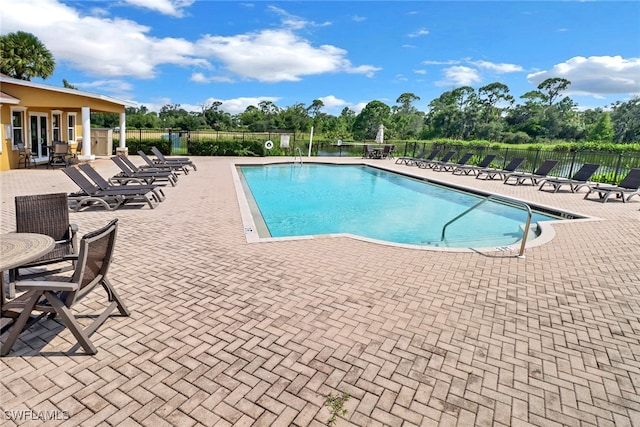 view of pool featuring a patio