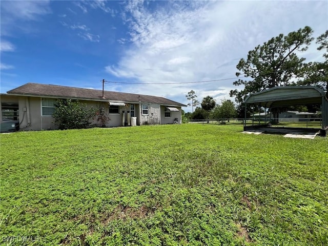 view of yard with a carport