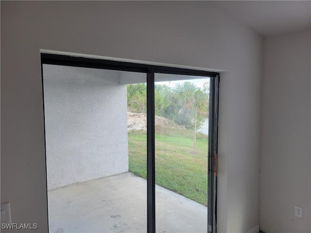 doorway with concrete flooring