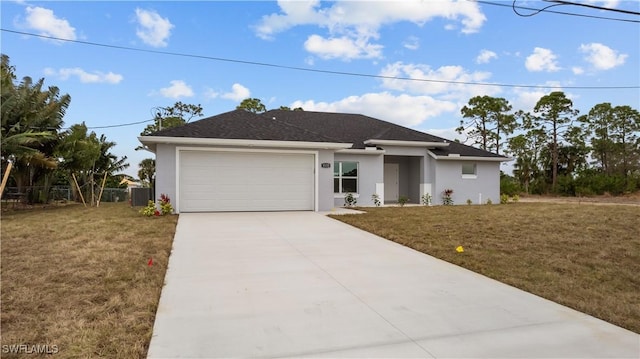 view of front of property with a front yard, a garage, and cooling unit