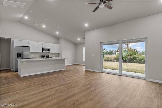 unfurnished living room featuring high vaulted ceiling, light wood-type flooring, and ceiling fan