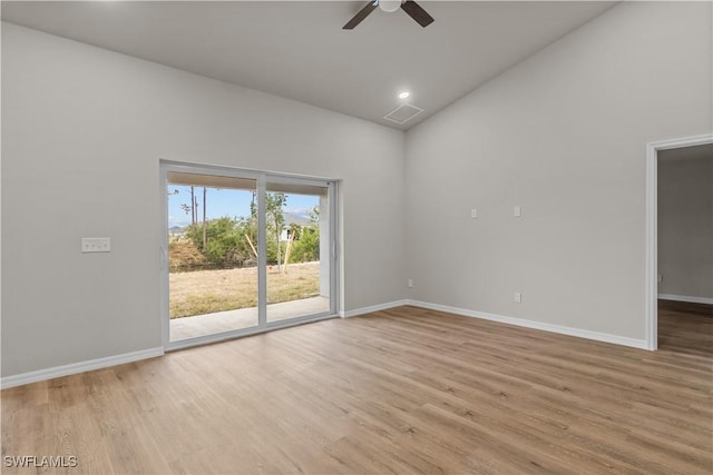 spare room with lofted ceiling, ceiling fan, and light hardwood / wood-style floors