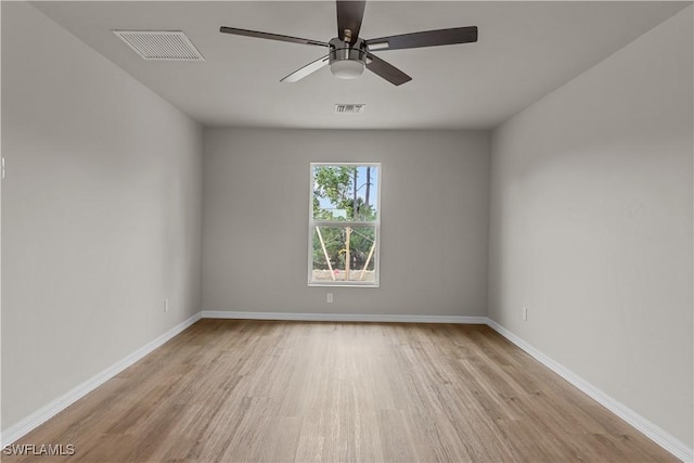 spare room with ceiling fan and light hardwood / wood-style floors