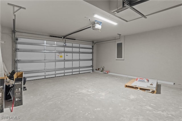 garage with electric panel and a garage door opener