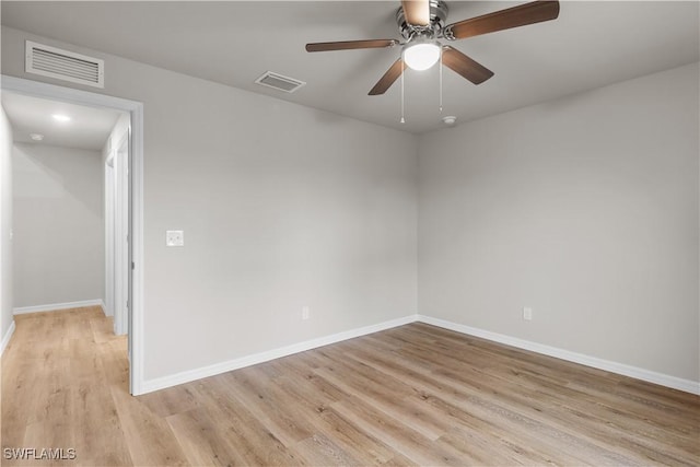 spare room featuring ceiling fan and light hardwood / wood-style floors