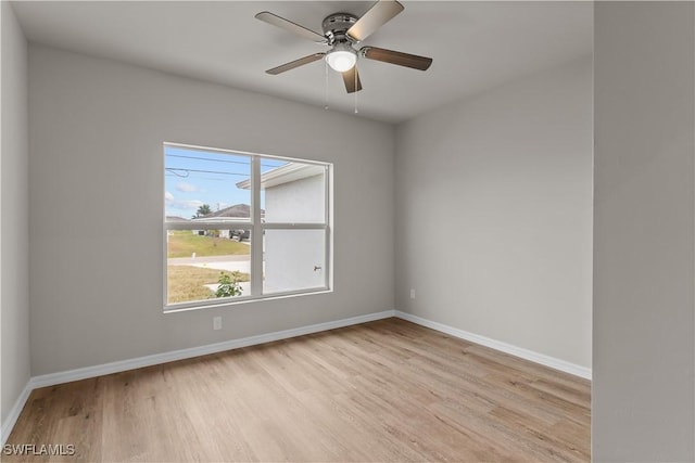 spare room featuring light wood-type flooring and ceiling fan