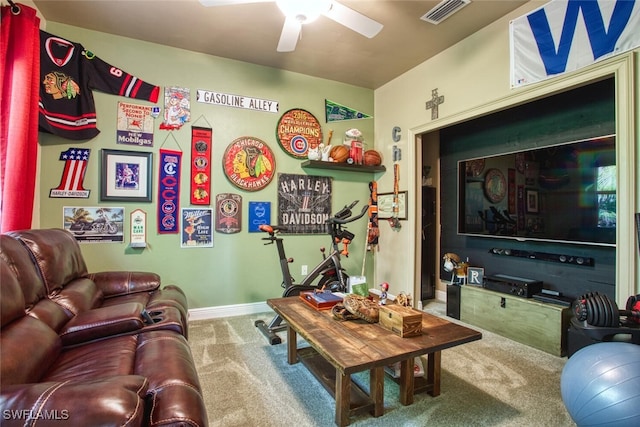 living room featuring ceiling fan and carpet