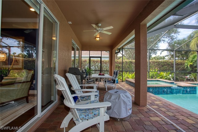 sunroom with ceiling fan and a swimming pool