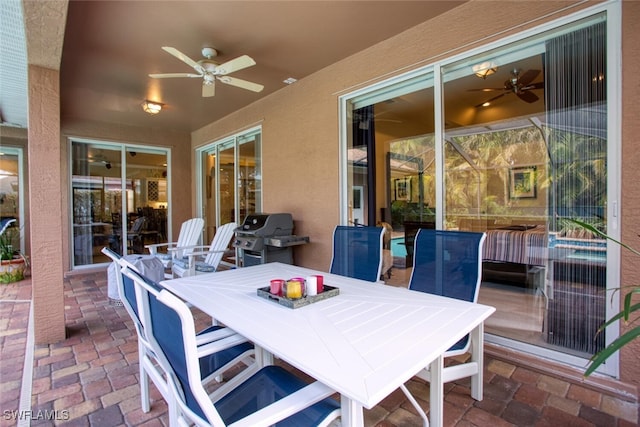 view of patio featuring ceiling fan and grilling area