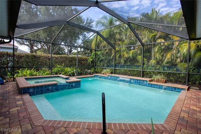 view of swimming pool with pool water feature, glass enclosure, and an in ground hot tub