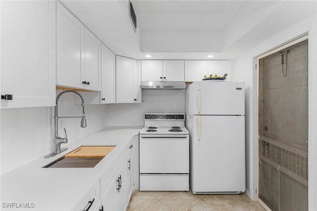 kitchen featuring white cabinets, light tile patterned flooring, white appliances, and sink