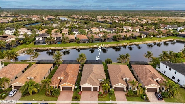 aerial view featuring a water view and a residential view