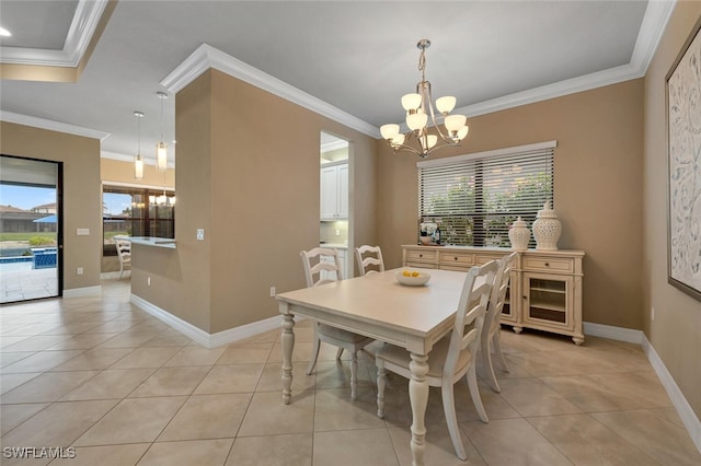 dining space with a chandelier, plenty of natural light, crown molding, and light tile patterned floors