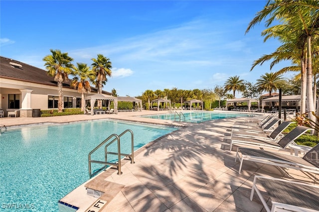 community pool featuring a patio and a gazebo