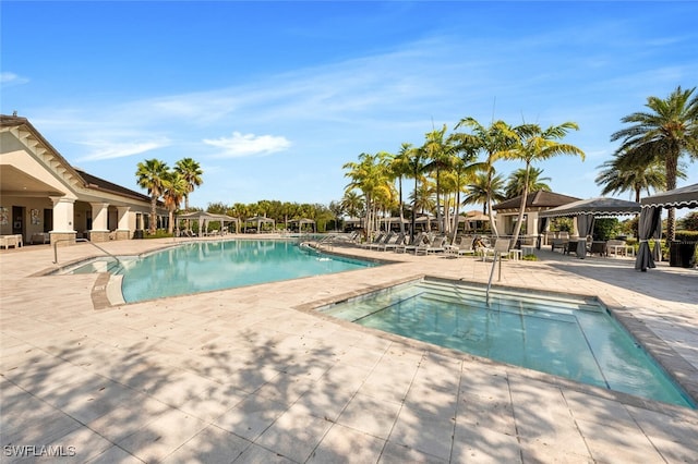 community pool featuring a patio area and a gazebo