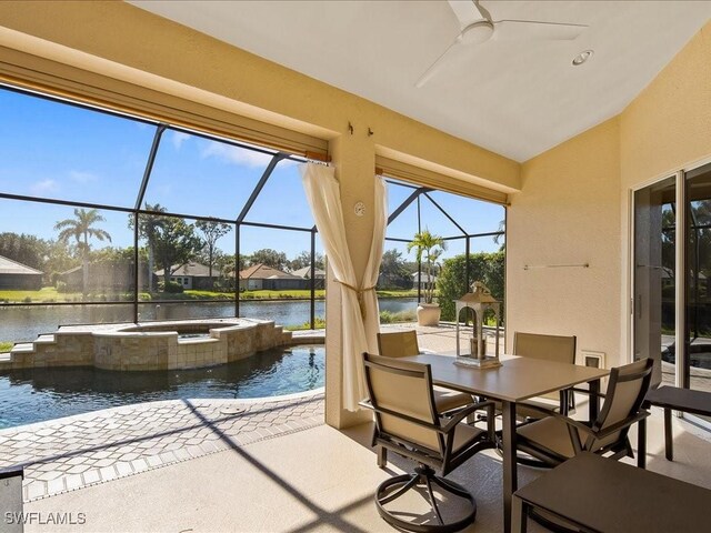 sunroom with a water view and vaulted ceiling