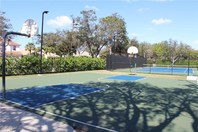 view of sport court featuring community basketball court and fence