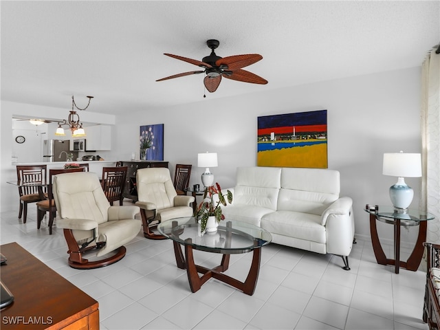 tiled living room featuring ceiling fan