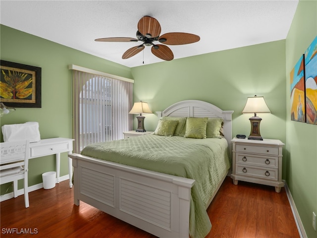 bedroom featuring ceiling fan and dark hardwood / wood-style flooring