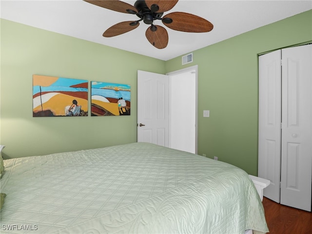 bedroom featuring a closet, ceiling fan, and hardwood / wood-style floors