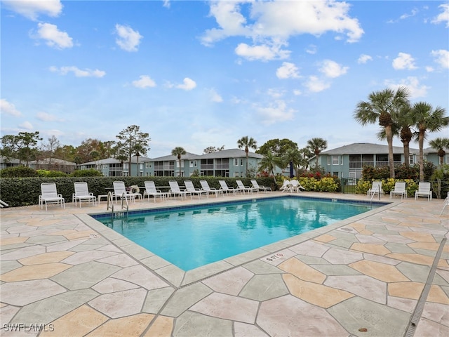 view of swimming pool with a patio