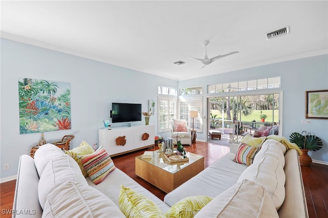 living room featuring ceiling fan, dark hardwood / wood-style floors, and ornamental molding