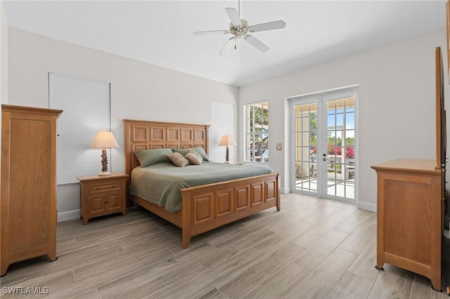 bedroom featuring access to exterior, ceiling fan, and french doors