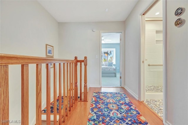 hall with light hardwood / wood-style floors