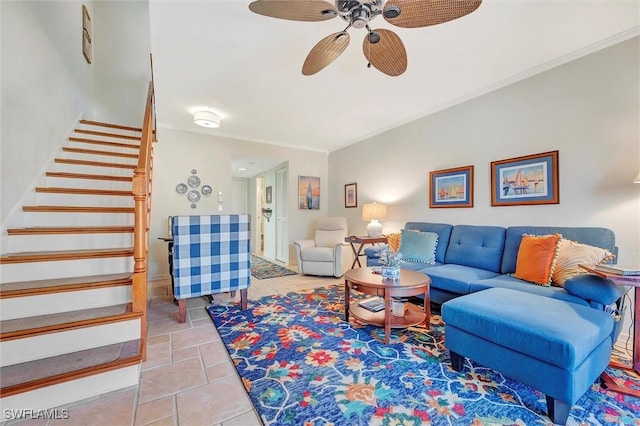 living room featuring ornamental molding, ceiling fan, and tile patterned floors