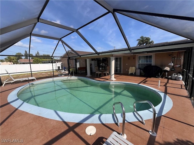 view of pool featuring a lanai and a patio