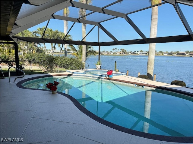 view of swimming pool featuring an in ground hot tub, a water view, and a lanai