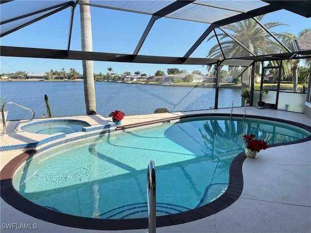 view of swimming pool with glass enclosure, an in ground hot tub, and a water view