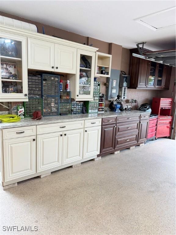 kitchen featuring dark brown cabinetry