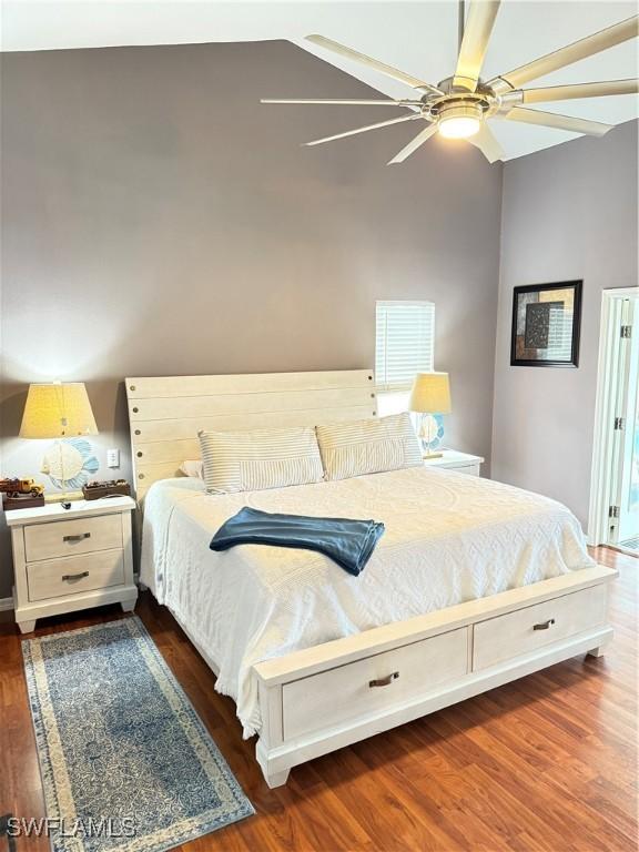 bedroom featuring ceiling fan and dark hardwood / wood-style flooring