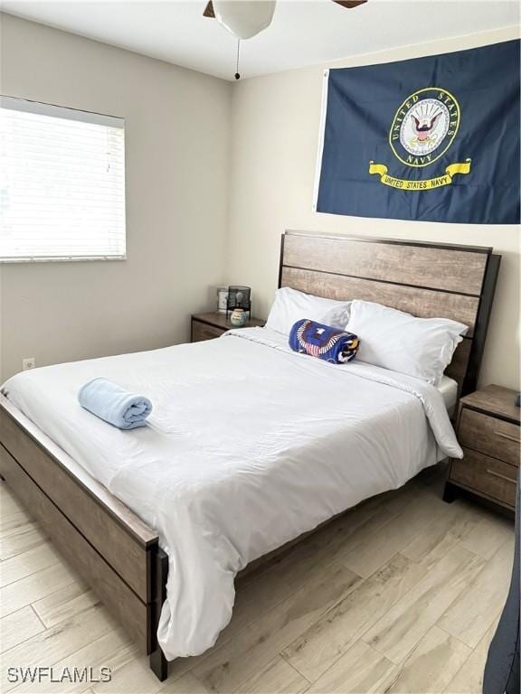 bedroom featuring ceiling fan and light wood-type flooring