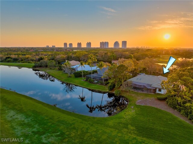 aerial view at dusk with a water view