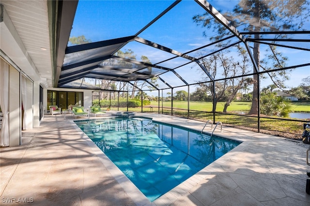 view of swimming pool featuring a lanai and a patio area