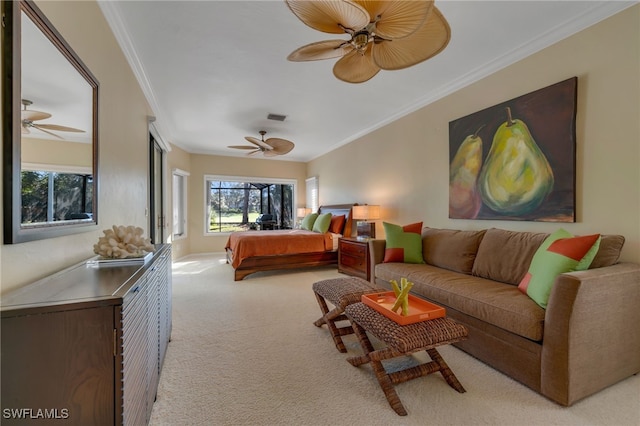 carpeted bedroom featuring ornamental molding and ceiling fan