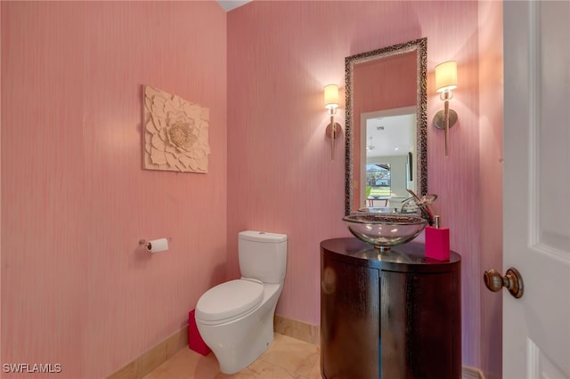 bathroom with toilet and vanity