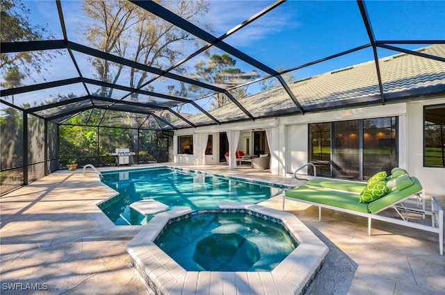 view of pool with a lanai, a patio, and an in ground hot tub