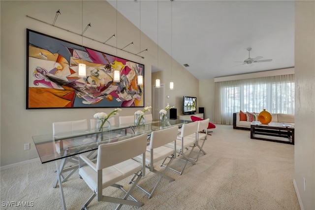 interior space with carpet floors, ceiling fan, and vaulted ceiling