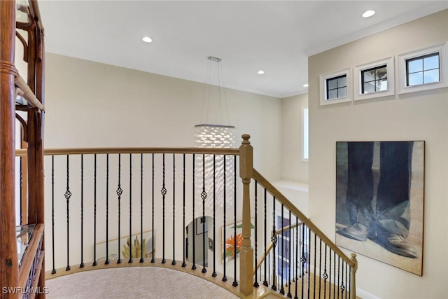 hallway with recessed lighting and an upstairs landing