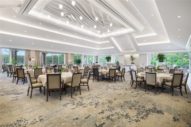 carpeted dining space featuring a raised ceiling and recessed lighting