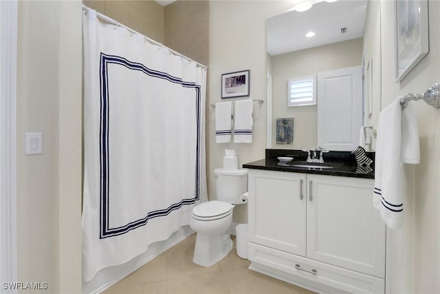 bathroom featuring toilet, tile patterned flooring, visible vents, and vanity