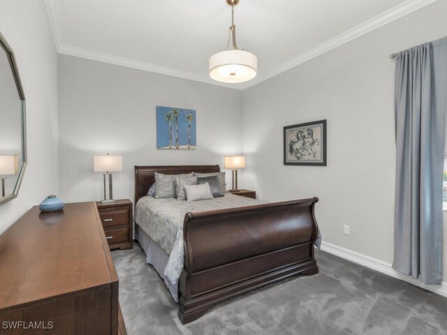 bedroom with ornamental molding and dark colored carpet