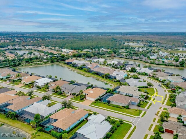 birds eye view of property with a water view